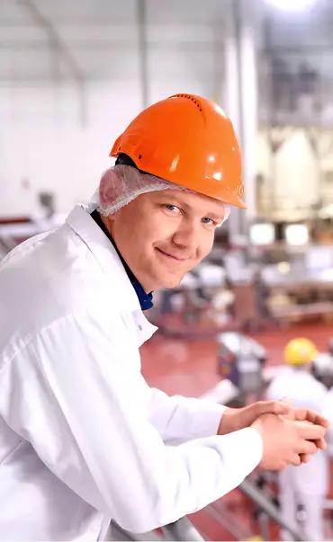 Worker overlooking factory
